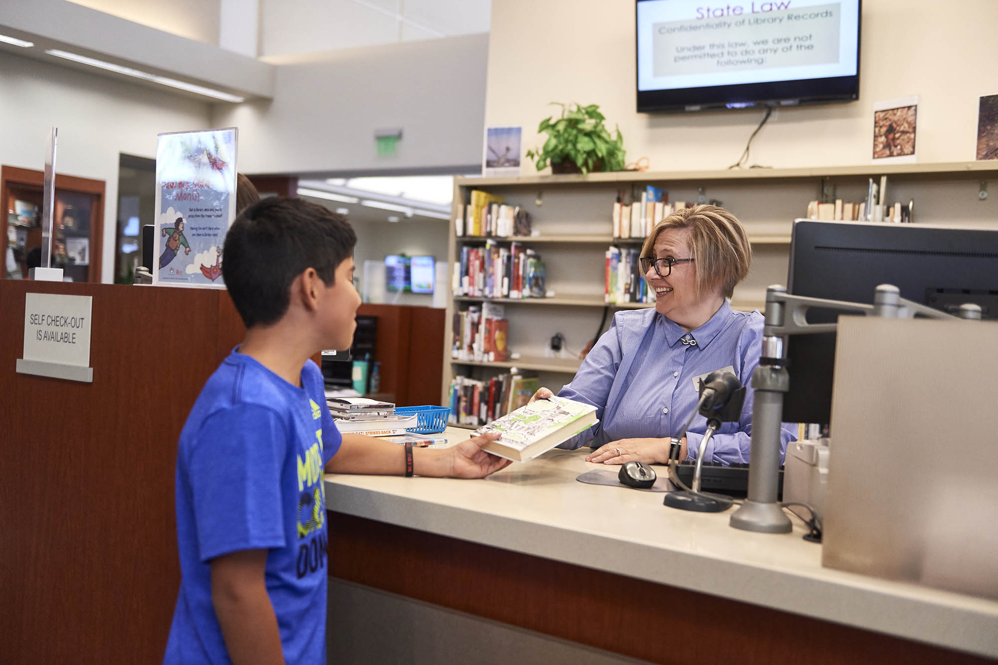 RCLS Staff Person with Young Boy